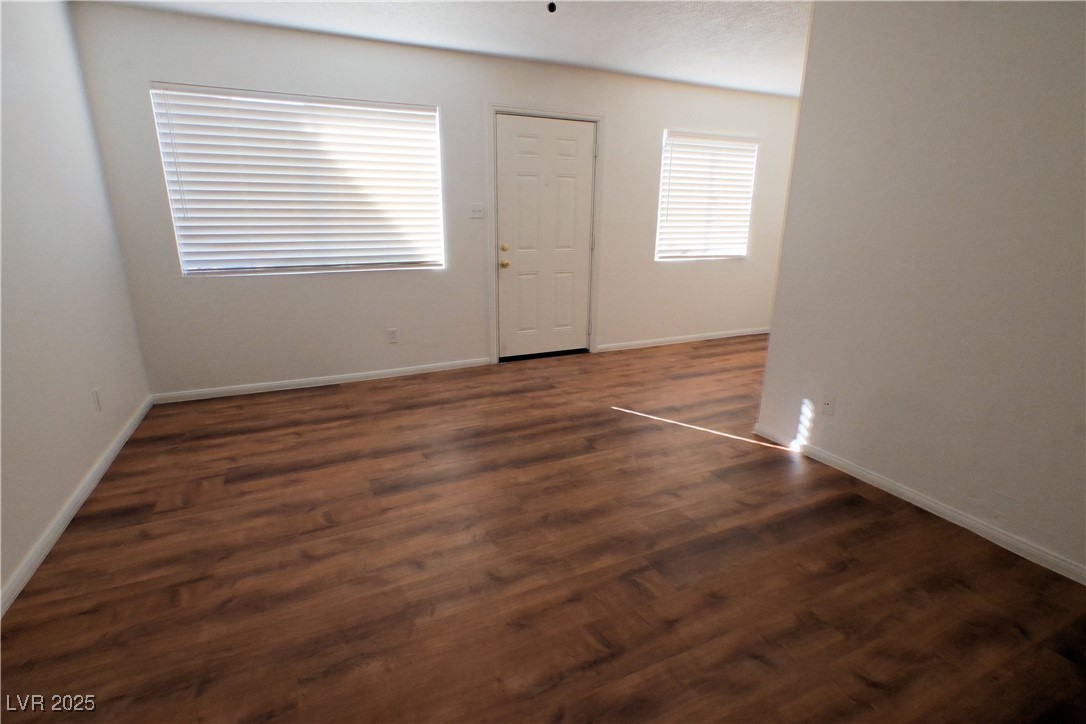 2608 East Mesquite Avenue, Unit 3 Las Vegas, NV 89101 - Photo 13 of 16 Unfurnished room featuring dark wood-style floors and a textured ceiling