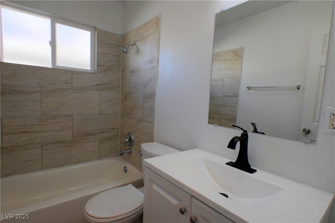 2608 East Mesquite Avenue, Unit 3 Las Vegas, NV 89101 - Photo 8 of 16 Bathroom featuring shower / bathtub combination and vanity