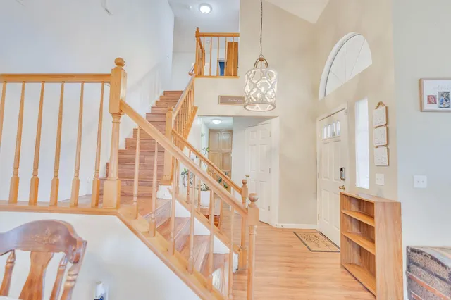 a kitchen with white cabinets and refrigerator