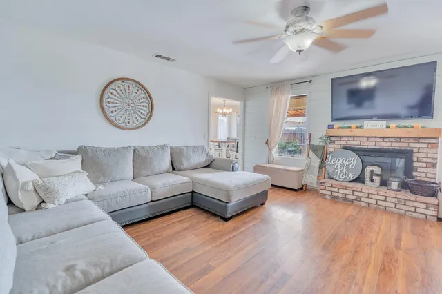 a view of an outdoor sitting area with furniture and wooden floor