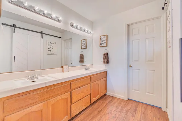 an aerial view of a house with garden space and street view