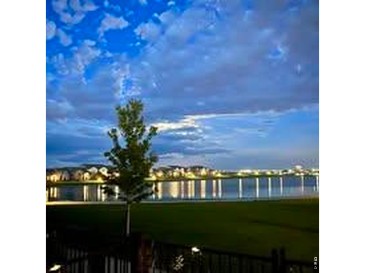 6316 Pumpkin Ridge Drive, Unit 1 Windsor, CO 80550 - Photo 39 of 50 Evening Water View