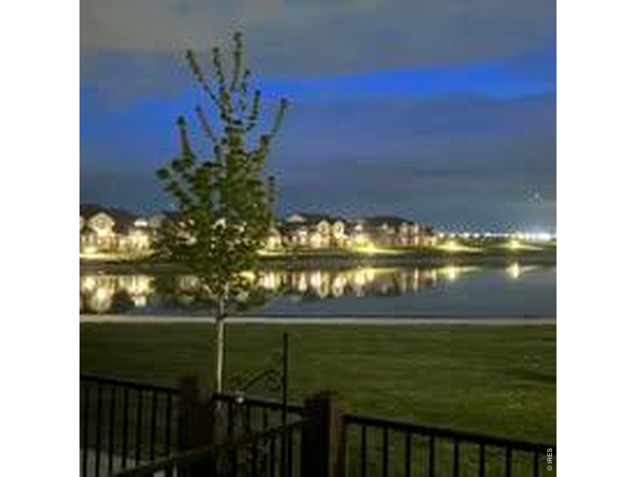 6316 Pumpkin Ridge Drive, Unit 1 Windsor, CO 80550 - Photo 40 of 50 Evening Water View