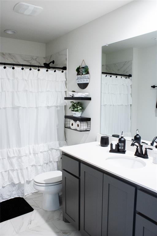 642 Sandiford Court Mansfield, TX 76063 - Photo 27 of 40 a bathroom with a sink a toilet and shower