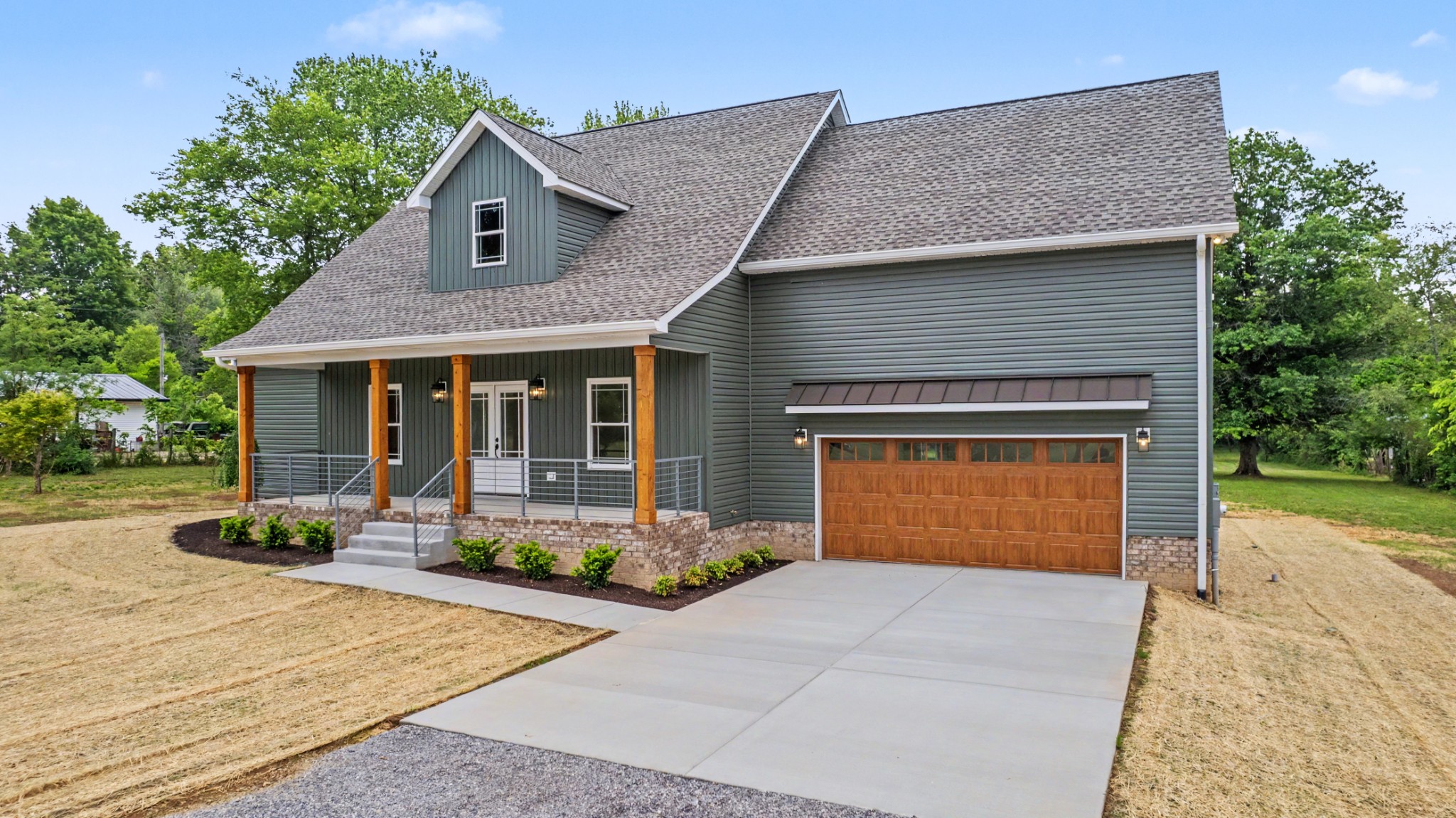5045 Hyde Road Springfield, TN 37172 - Photo 1 of 33 a front view of a house with a yard and potted plants