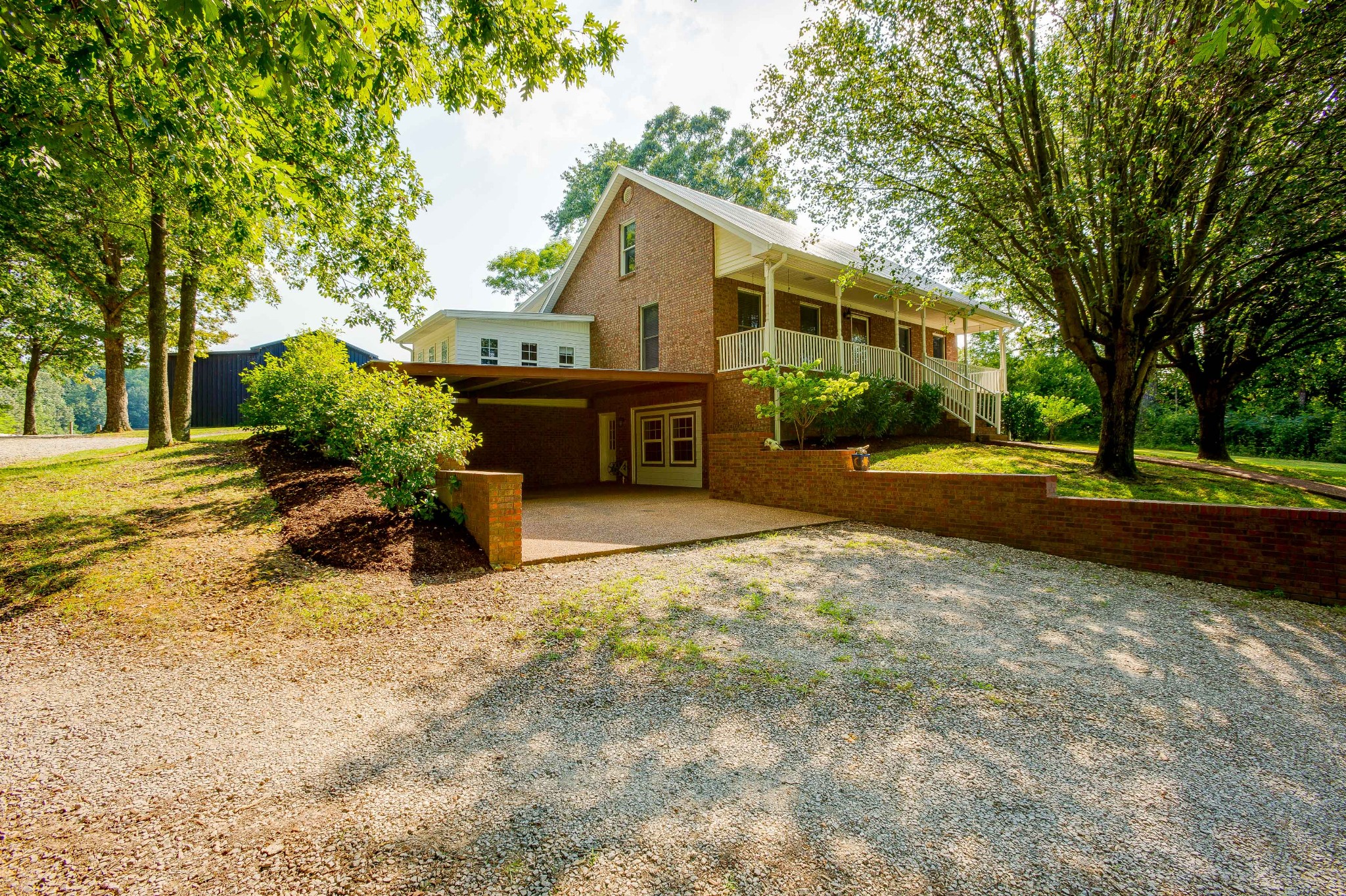 357 Blue Door Road Portland, TN 37148 - Photo 2 of 46 a view of a house with a yard and sitting area