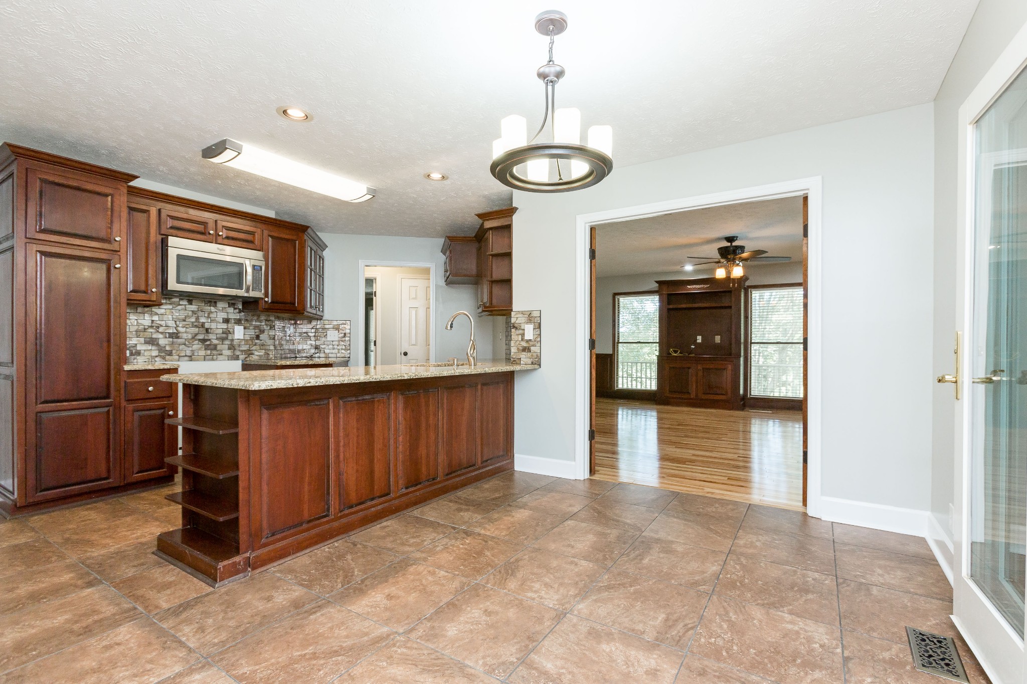 357 Blue Door Road Portland, TN 37148 - Photo 11 of 46 a kitchen with stainless steel appliances granite countertop a sink and cabinets