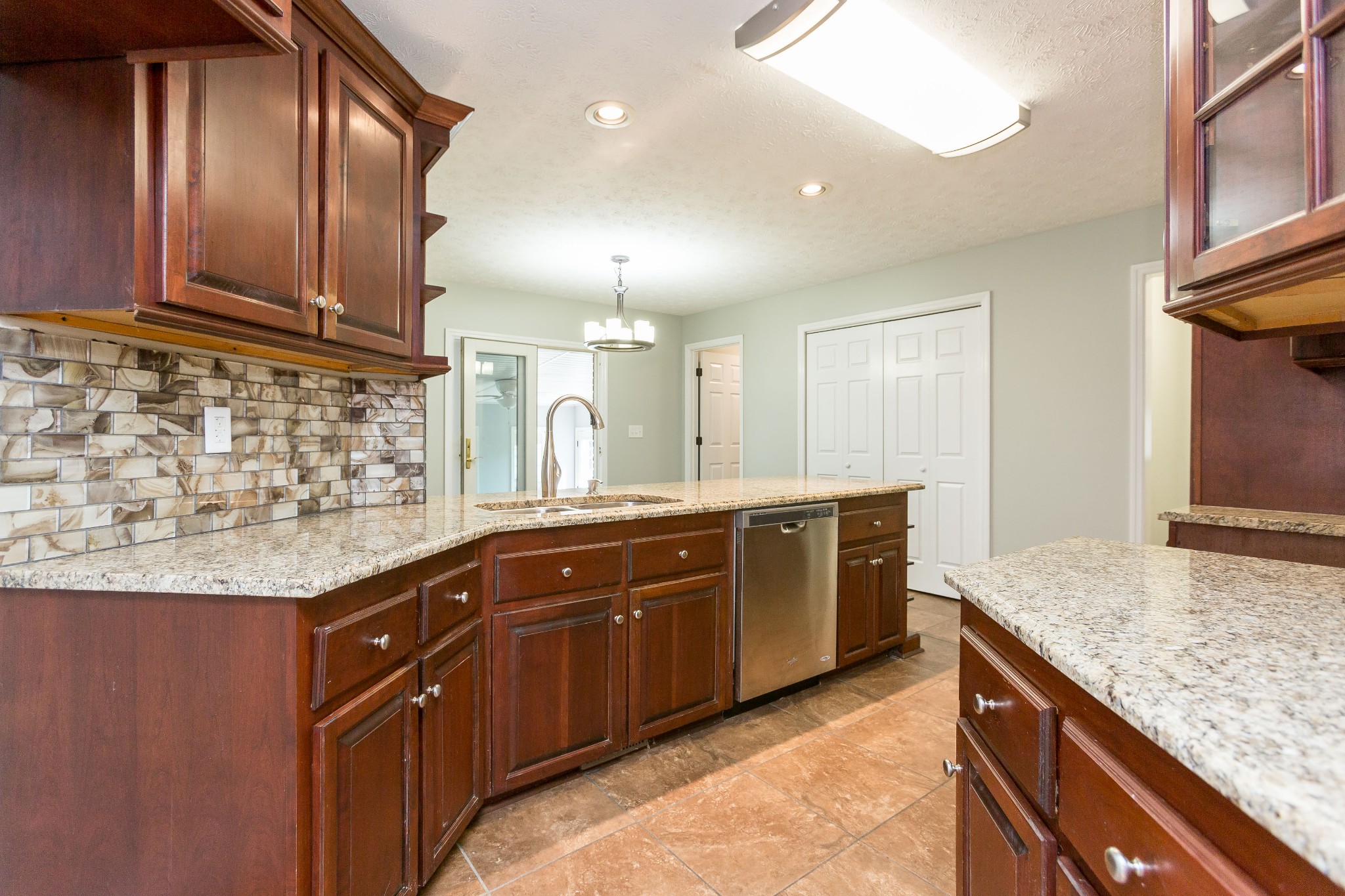 357 Blue Door Road Portland, TN 37148 - Photo 12 of 46 a kitchen with stainless steel appliances granite countertop wooden cabinets a oven and granite counter tops