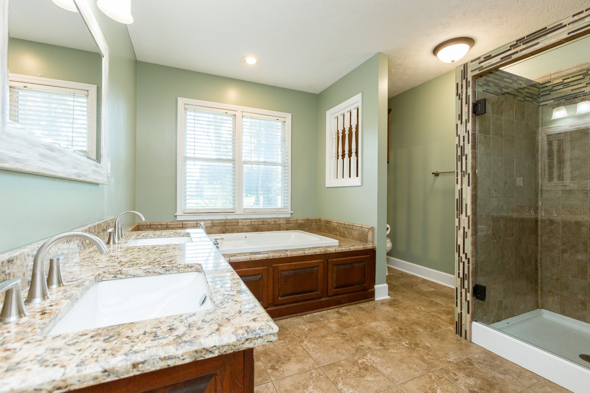 357 Blue Door Road Portland, TN 37148 - Photo 17 of 46 a spacious bathroom with a granite countertop tub sink and shower