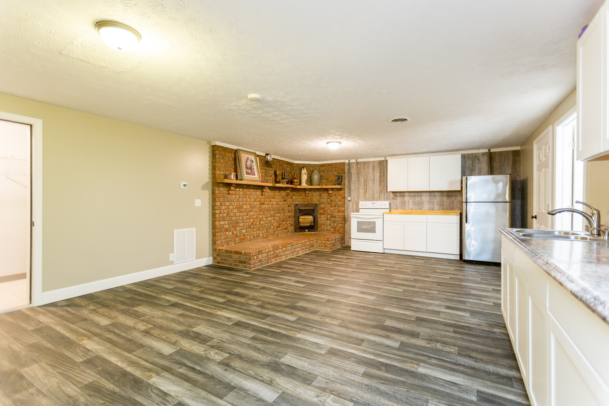357 Blue Door Road Portland, TN 37148 - Photo 21 of 46 a view of a kitchen with a sink and a refrigerator