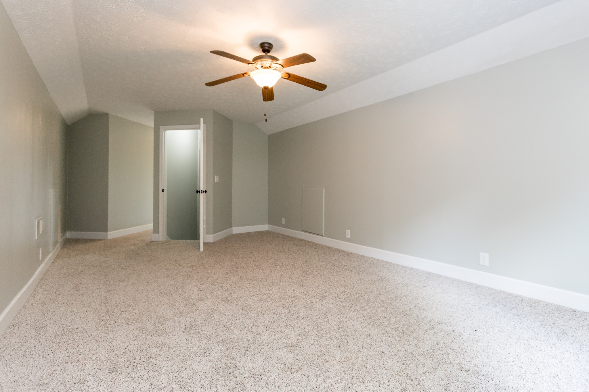 357 Blue Door Road Portland, TN 37148 - Photo 23 of 46 an empty room with a chandelier fan and windows