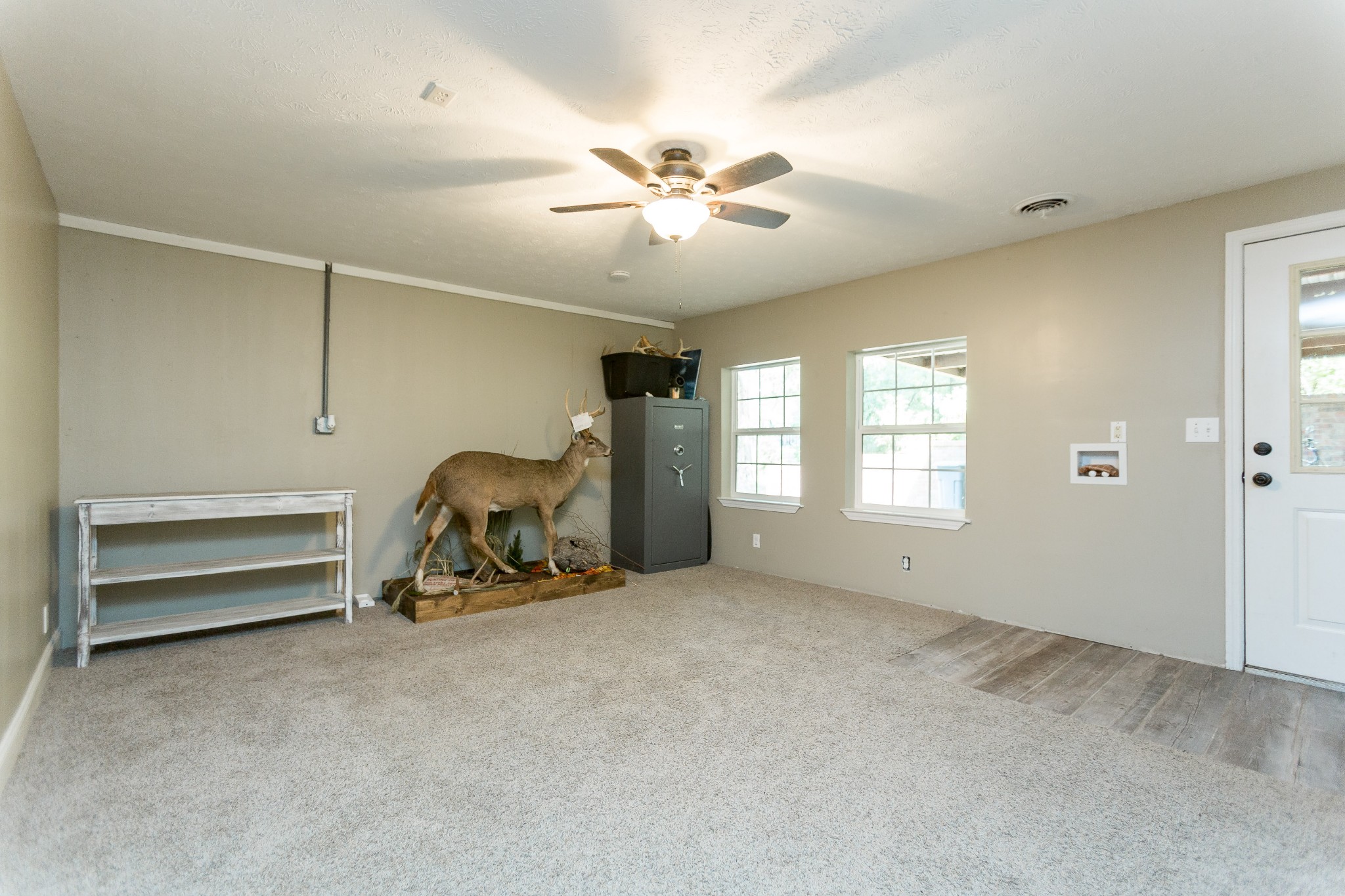 357 Blue Door Road Portland, TN 37148 - Photo 29 of 46 a room with a ceiling fan and gym equipment