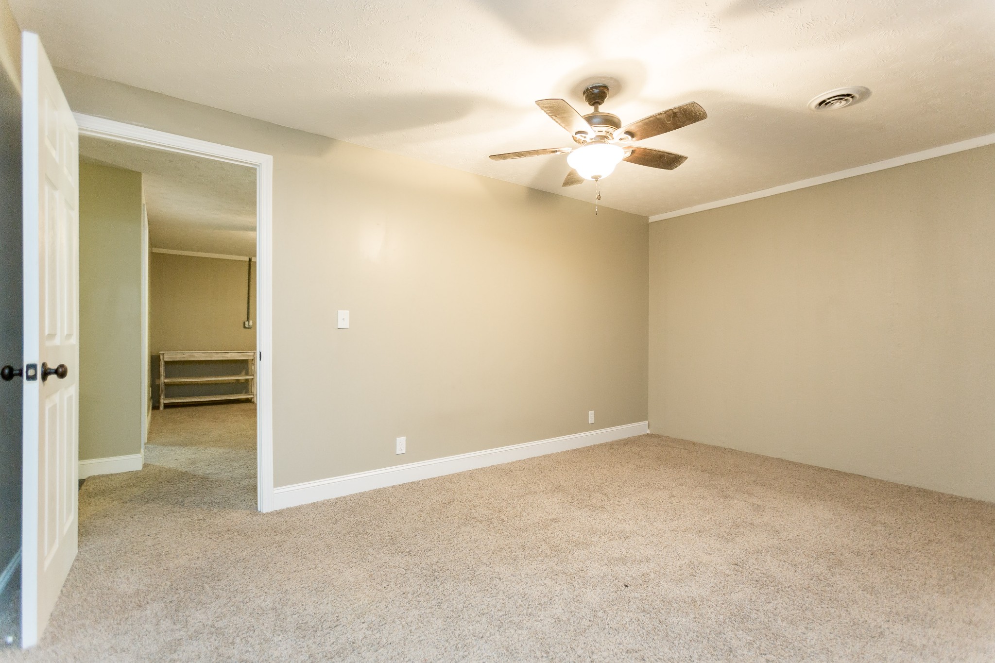 357 Blue Door Road Portland, TN 37148 - Photo 30 of 46 an empty room with closet and a chandelier fan