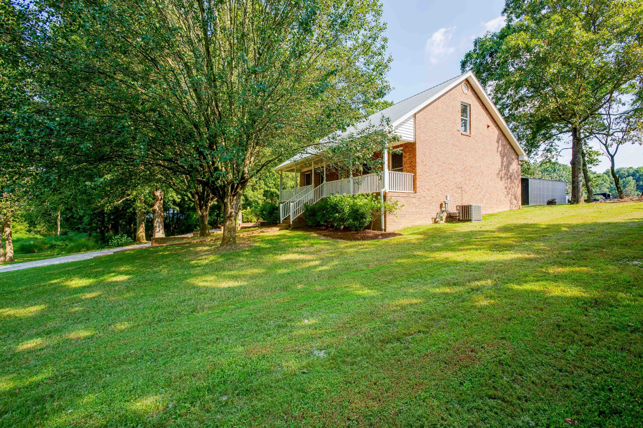 357 Blue Door Road Portland, TN 37148 - Photo 4 of 46 a view of a house with backyard and trees
