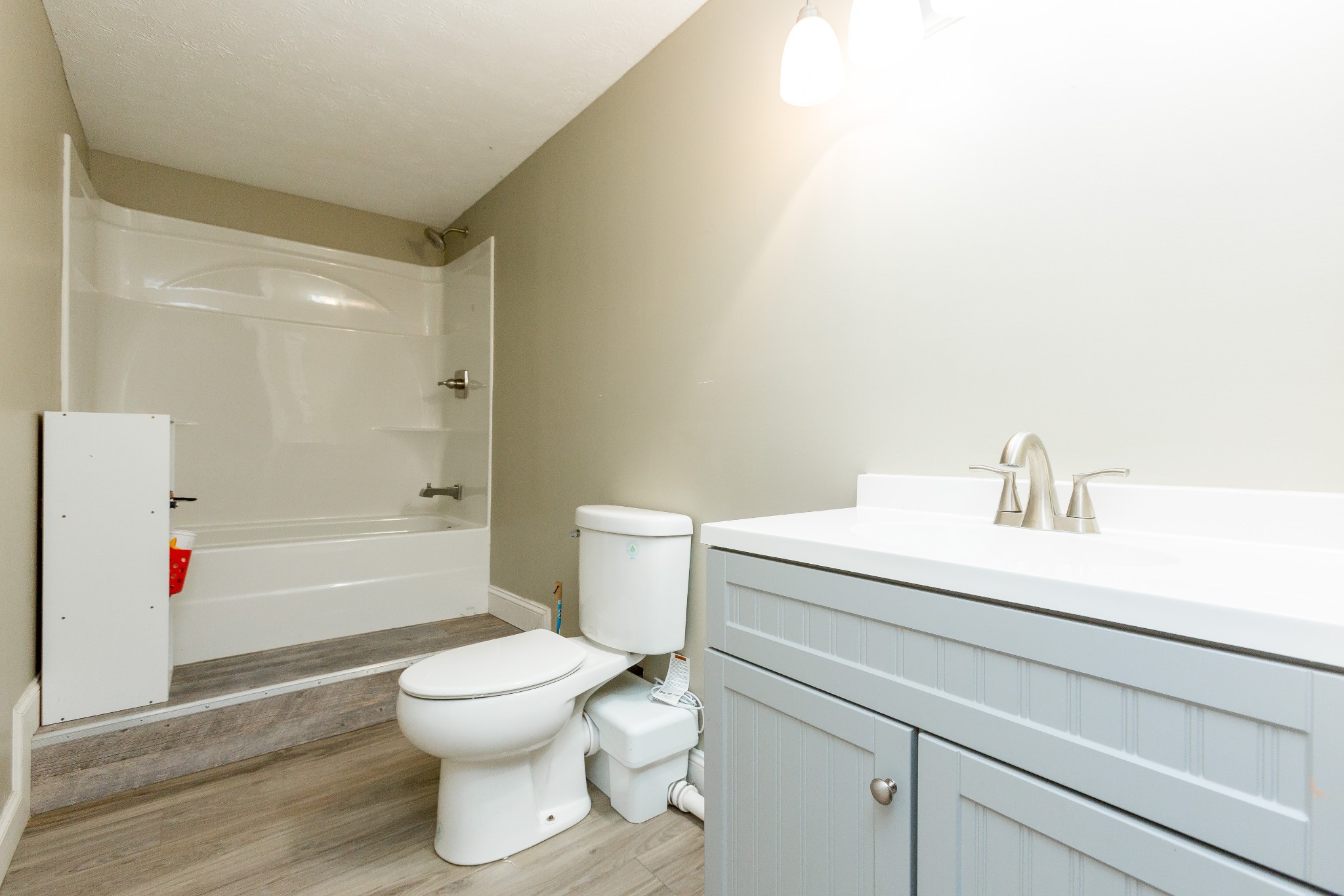 357 Blue Door Road Portland, TN 37148 - Photo 33 of 46 a bathroom with a sink a toilet and a shower