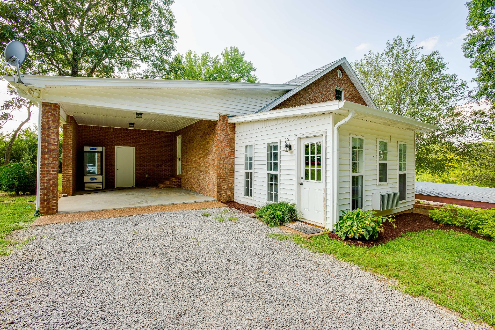 357 Blue Door Road Portland, TN 37148 - Photo 38 of 46 a front view of a house with garden