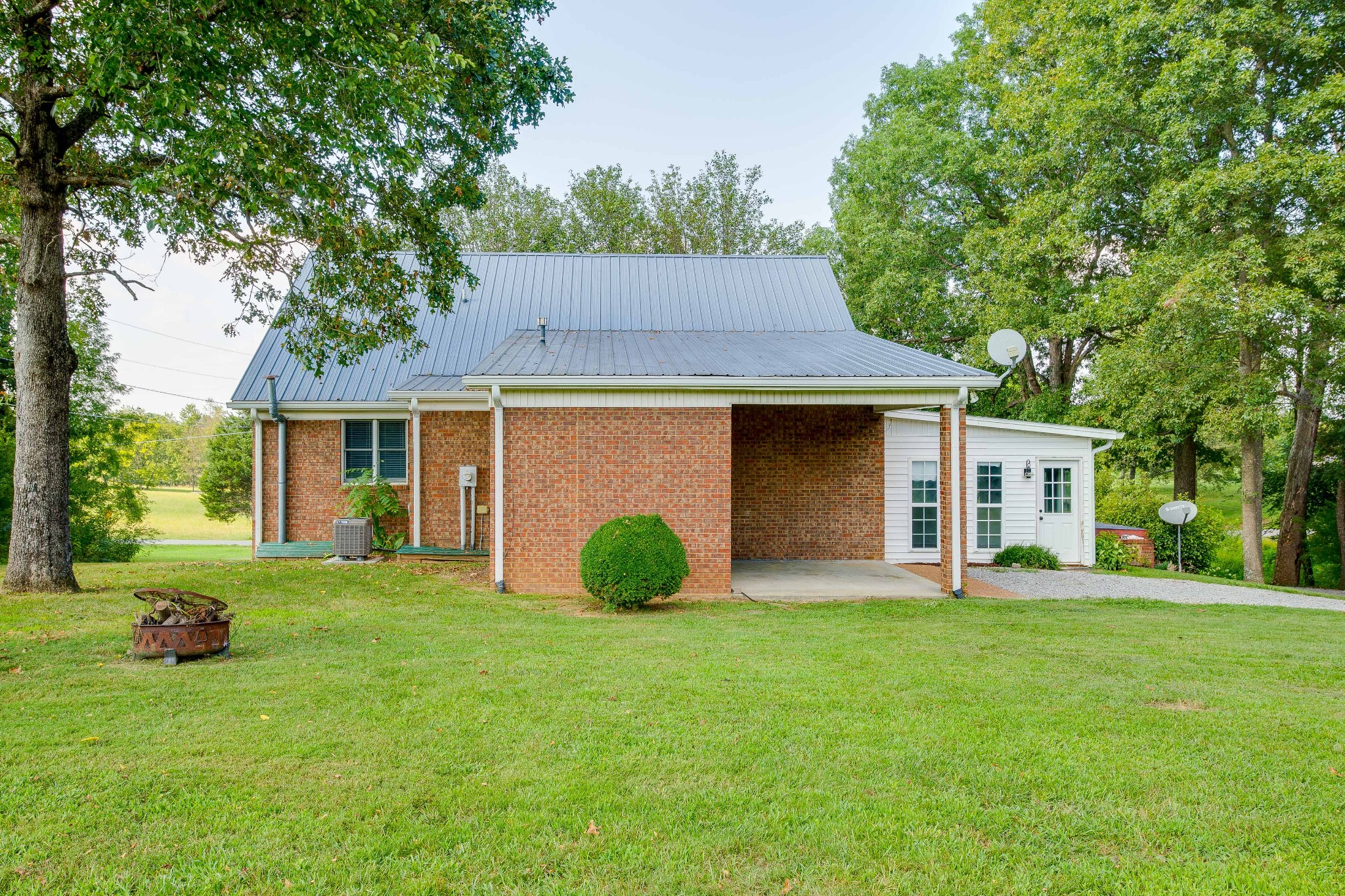 357 Blue Door Road Portland, TN 37148 - Photo 42 of 46 a view of a house with a yard and sitting area