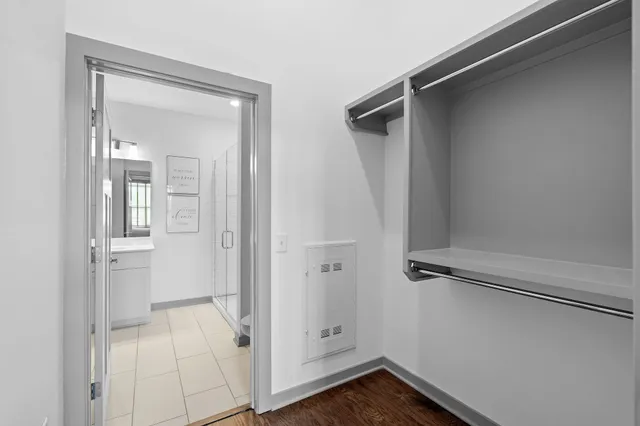 a view of a room with wooden floor