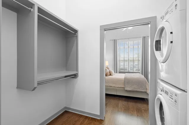 a bedroom with a bed and a mirror