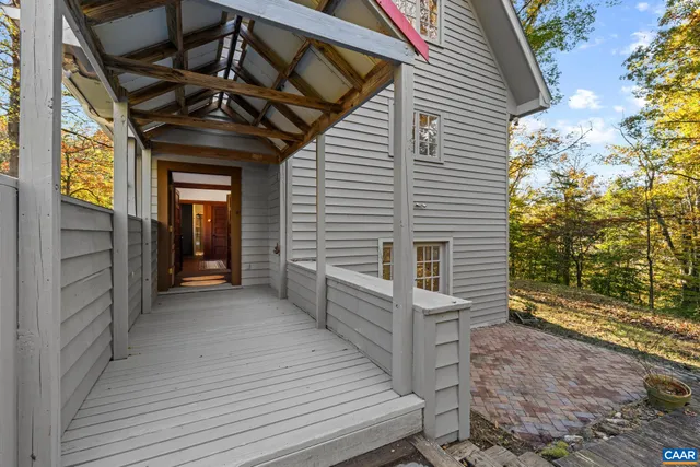 a view of a porch with wooden floor and fence