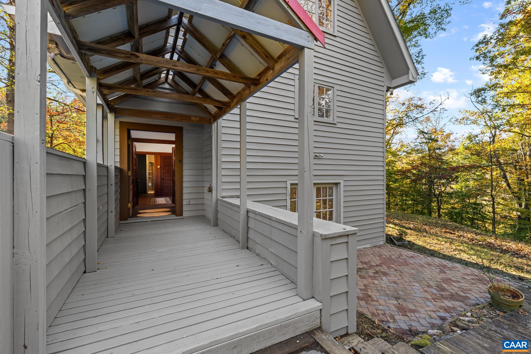 9712 Old Green Mountain Road Esmont, VA 22937 - Photo 14 of 42 a view of a porch with wooden floor and fence