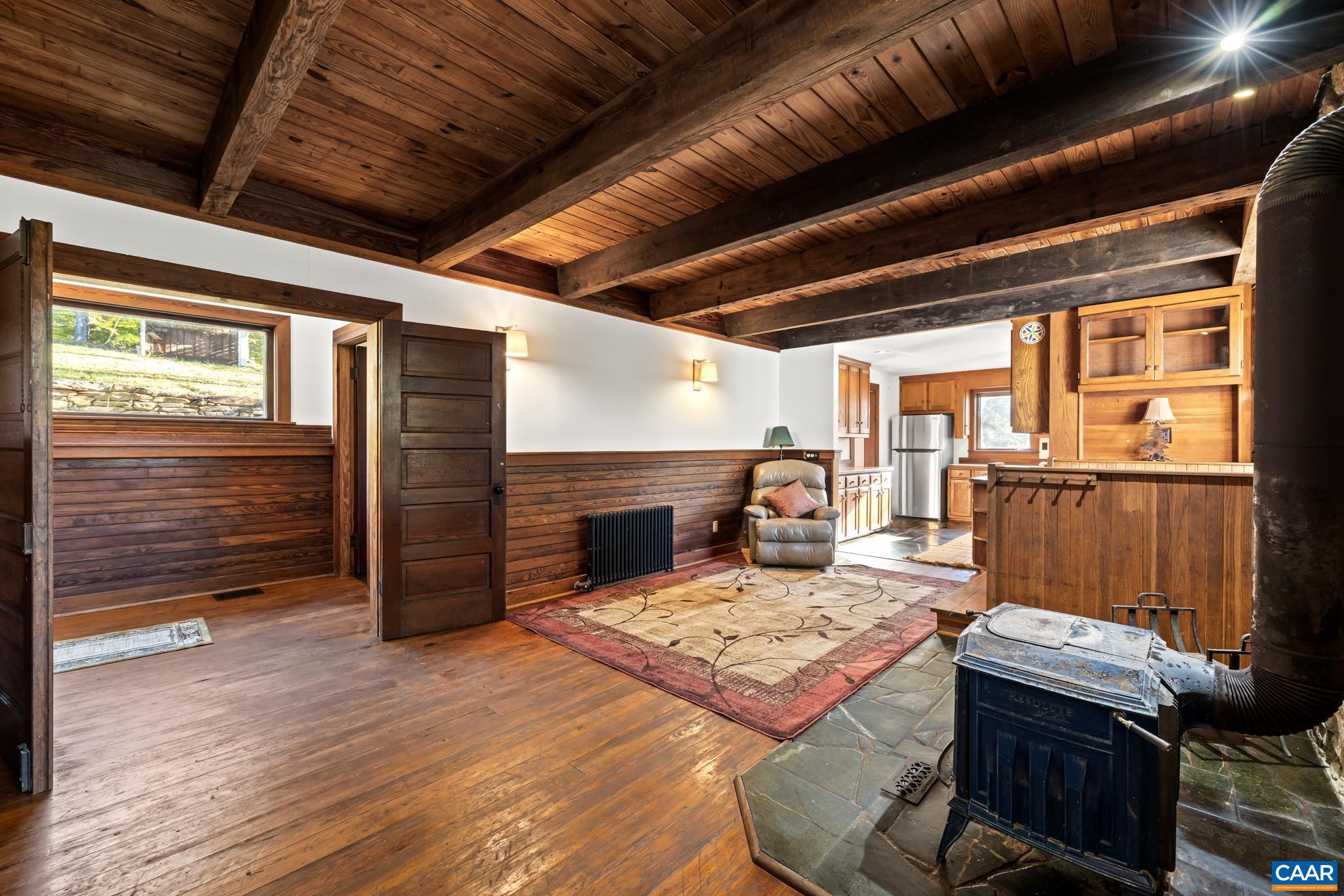 9712 Old Green Mountain Road Esmont, VA 22937 - Photo 18 of 42 a view of a livingroom with furniture window and wooden floor