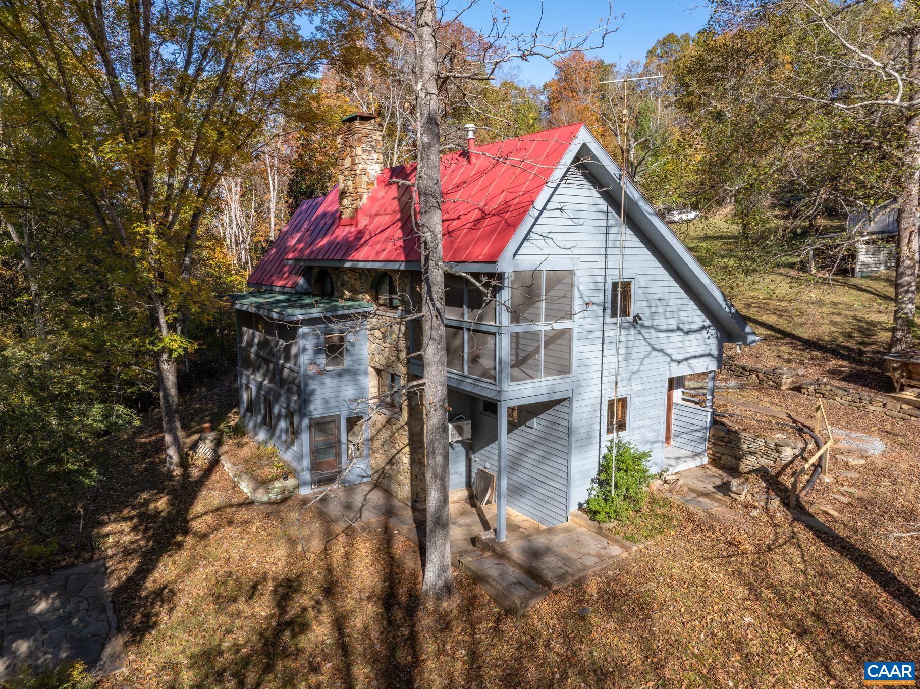 9712 Old Green Mountain Road Esmont, VA 22937 - Photo 2 of 42 a view of house with a yard and sitting area
