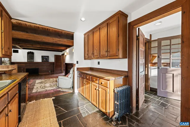 a bathroom with a glass door shower a mirror