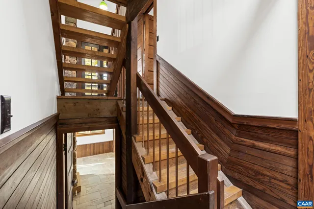 a bedroom with a bed and a view of bathroom