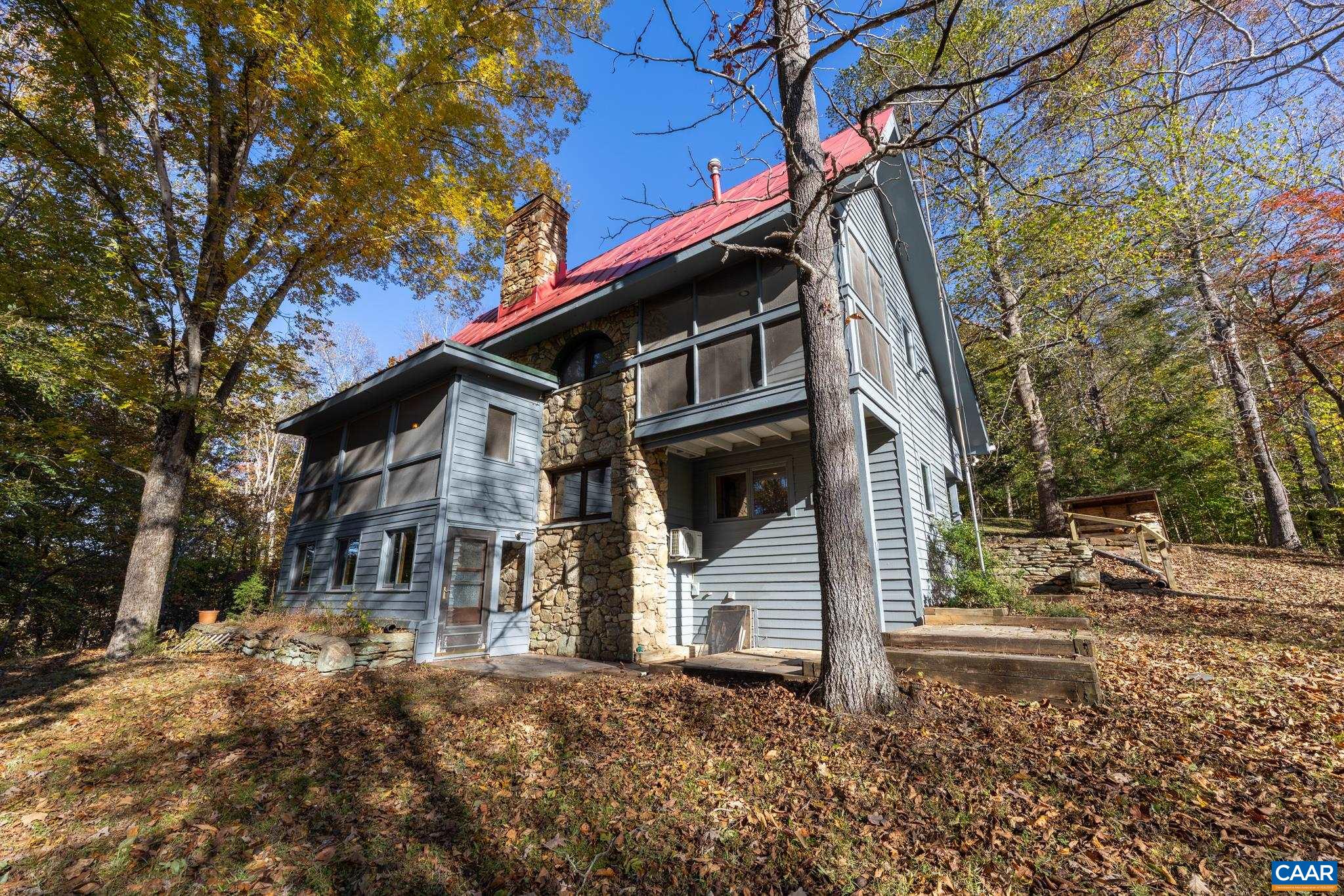 9712 Old Green Mountain Road Esmont, VA 22937 - Photo 3 of 42 a front view of a house with a yard