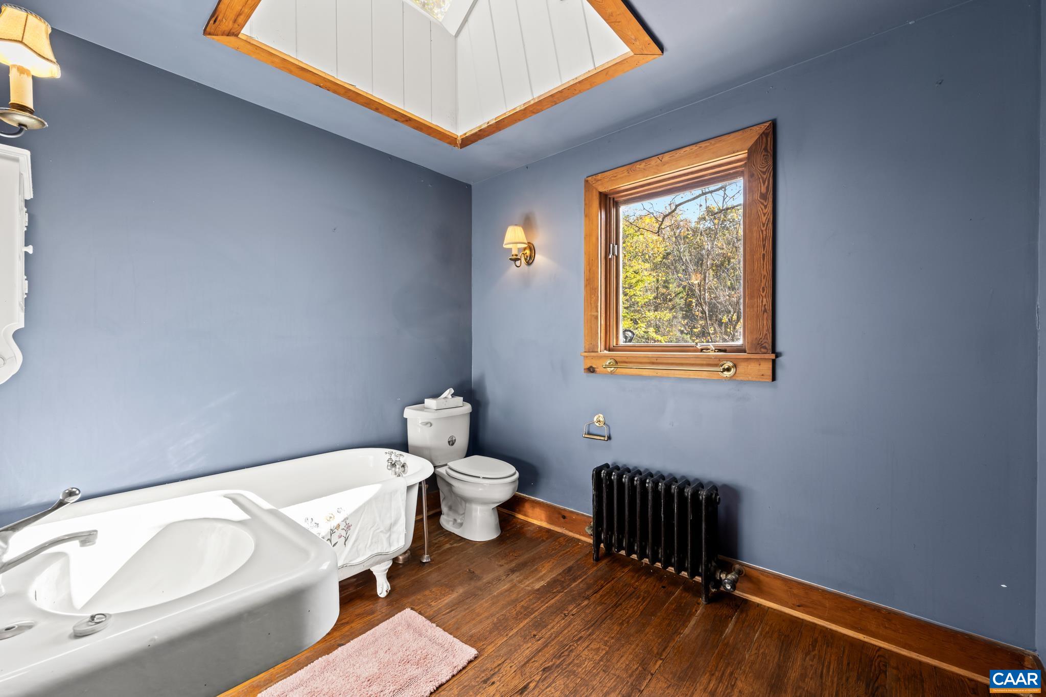 9712 Old Green Mountain Road Esmont, VA 22937 - Photo 33 of 42 a bathroom with a bathtub and a sink