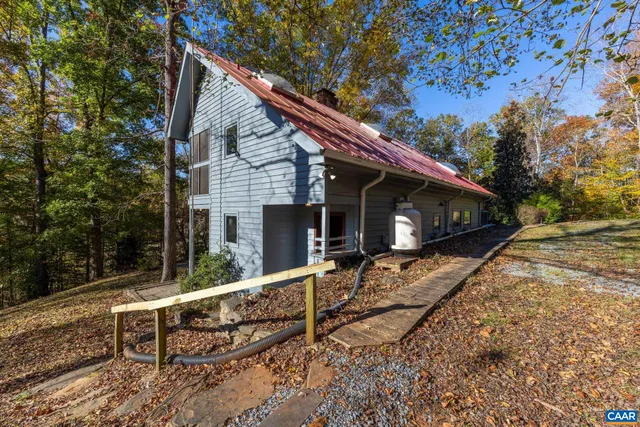a view of house with a back yard