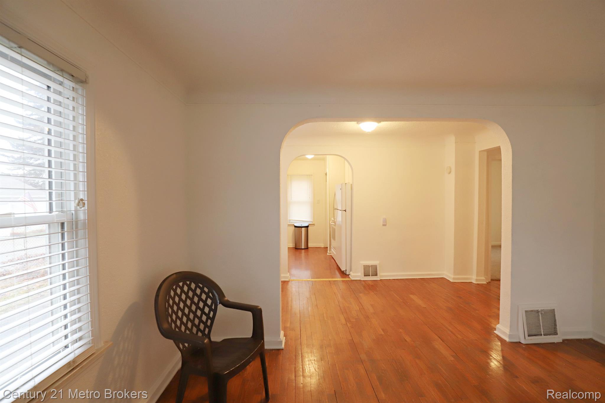2074 North Center Road Burton, MI 48509 - Photo 5 of 20 Hall featuring wood-type flooring and baseboards