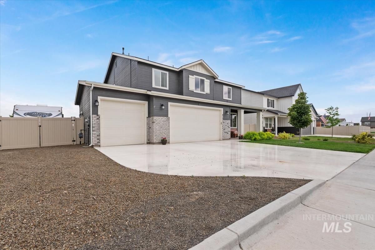 815 Knowledge Street Middleton, ID 83644 - Photo 40 of 49 Contemporary two-story exterior with dark gray siding and white trim accents