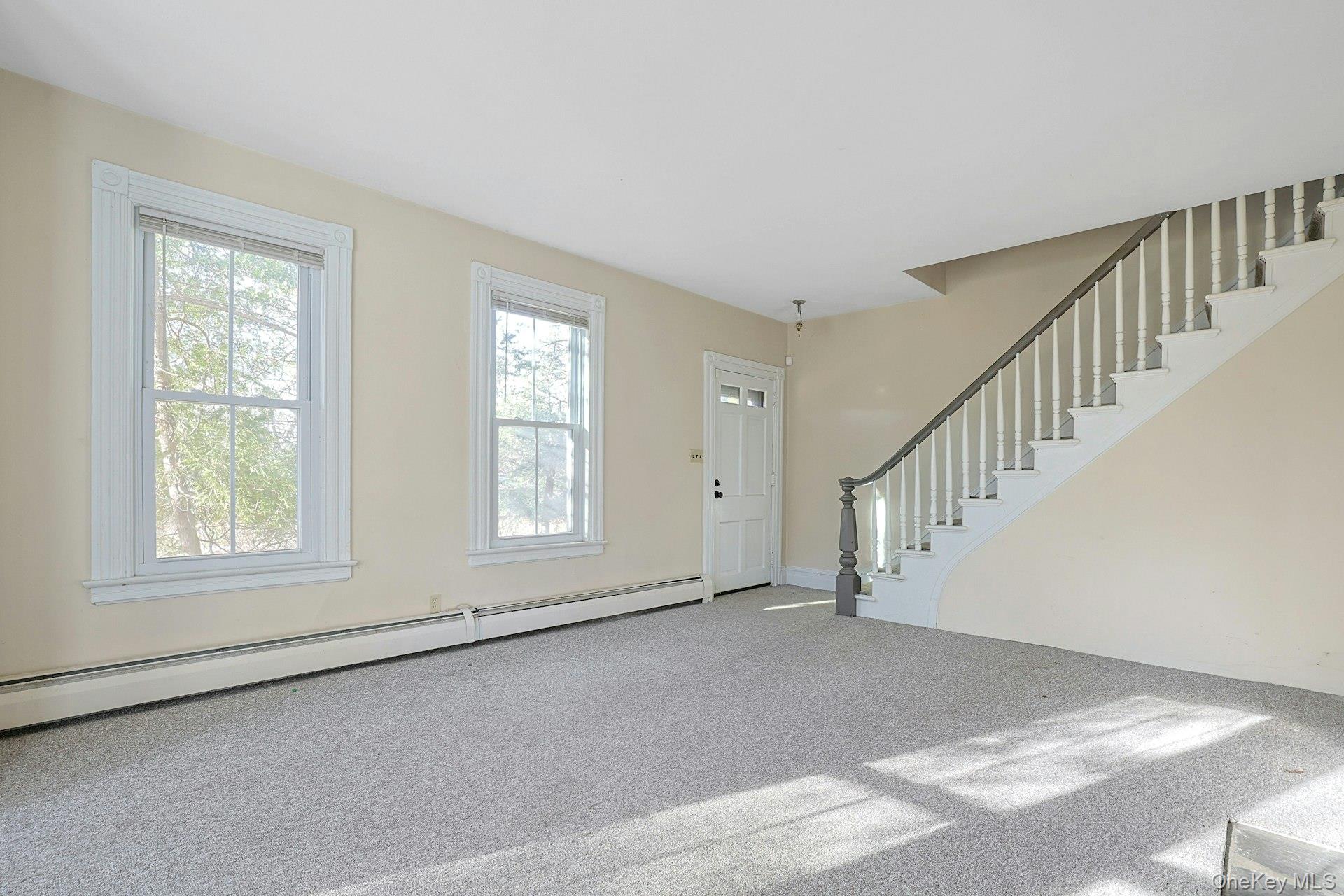 46 Mile Road Montebello, NY 10901 - Photo 10 of 25 Front living room w stairs to upper level