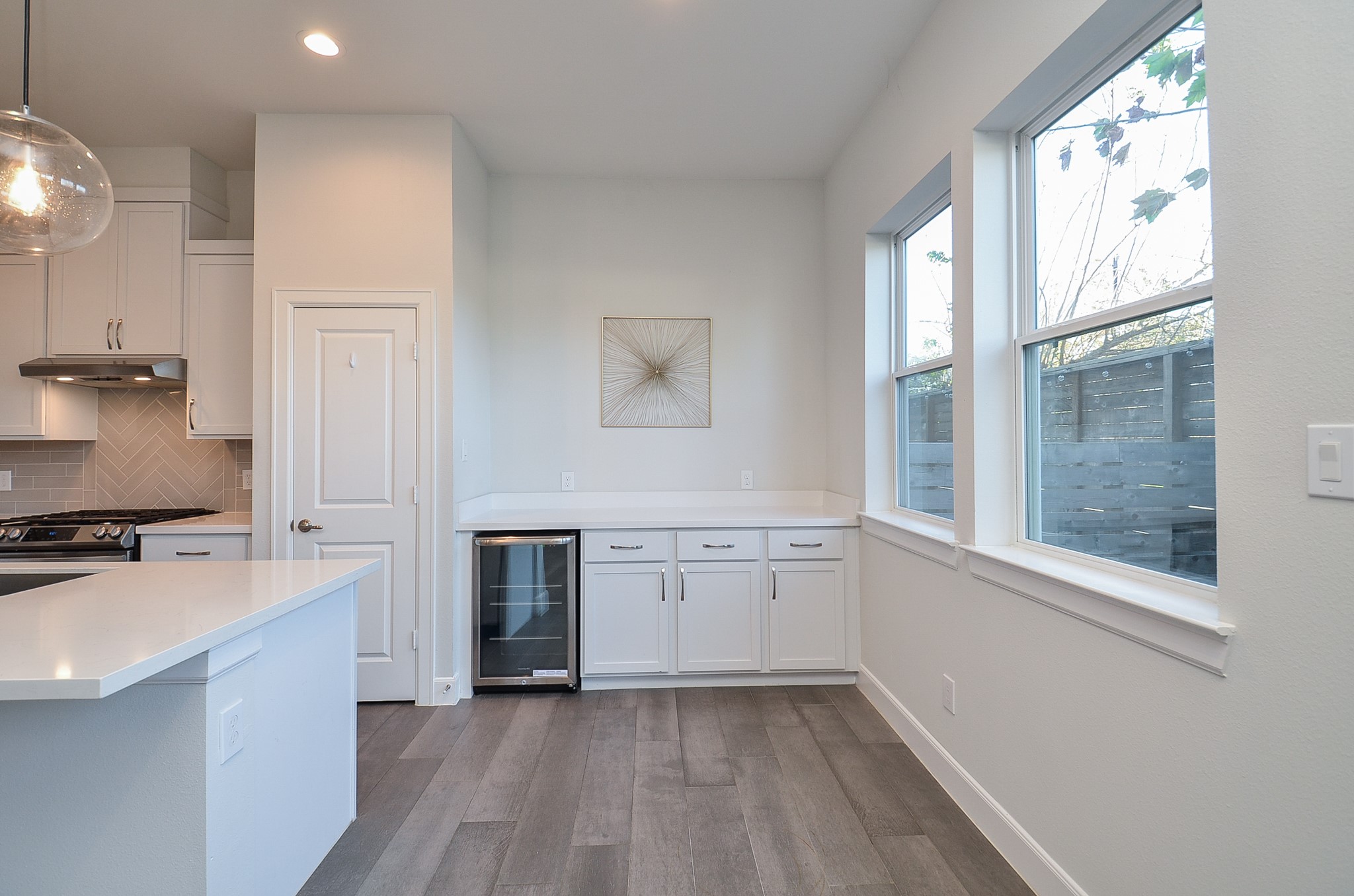 9577 Neuens Road, Unit F Houston, TX 77080 - Photo 13 of 26 Open dining space effortlessly connects the kitchen and living room, ideal for entertaining or casual family meals.