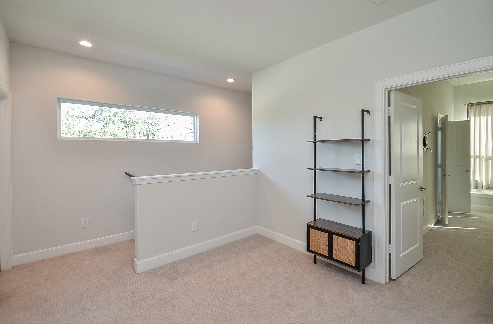 9577 Neuens Road, Unit F Houston, TX 77080 - Photo 16 of 26 Upstairs loft offers versatile space ideal for a home office, reading nook, or cozy lounge area.