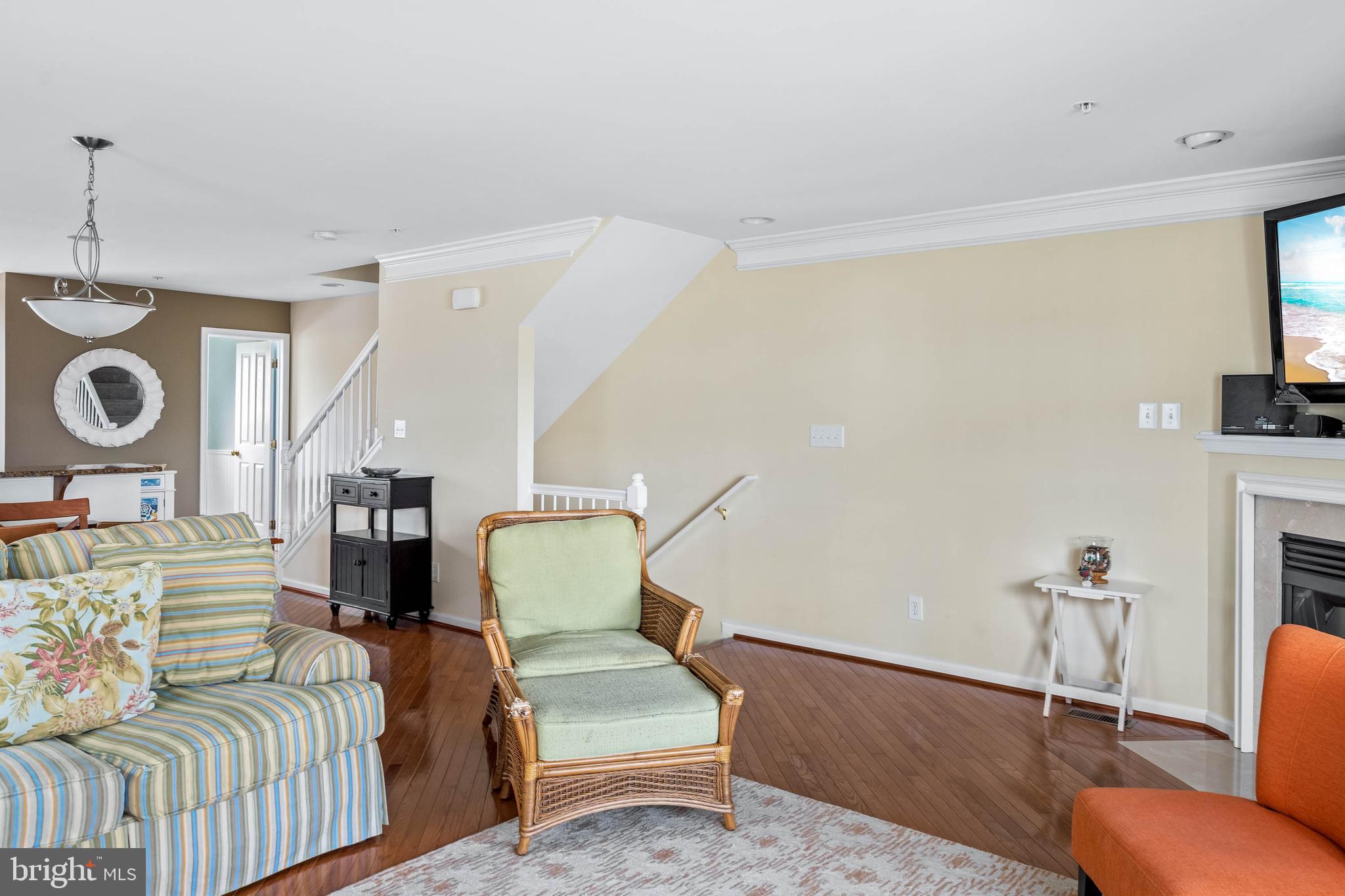 19901 Ames Drive, Unit 133 Rehoboth Beach, DE 19971 - Photo 14 of 34 a living room with furniture and a wooden floor