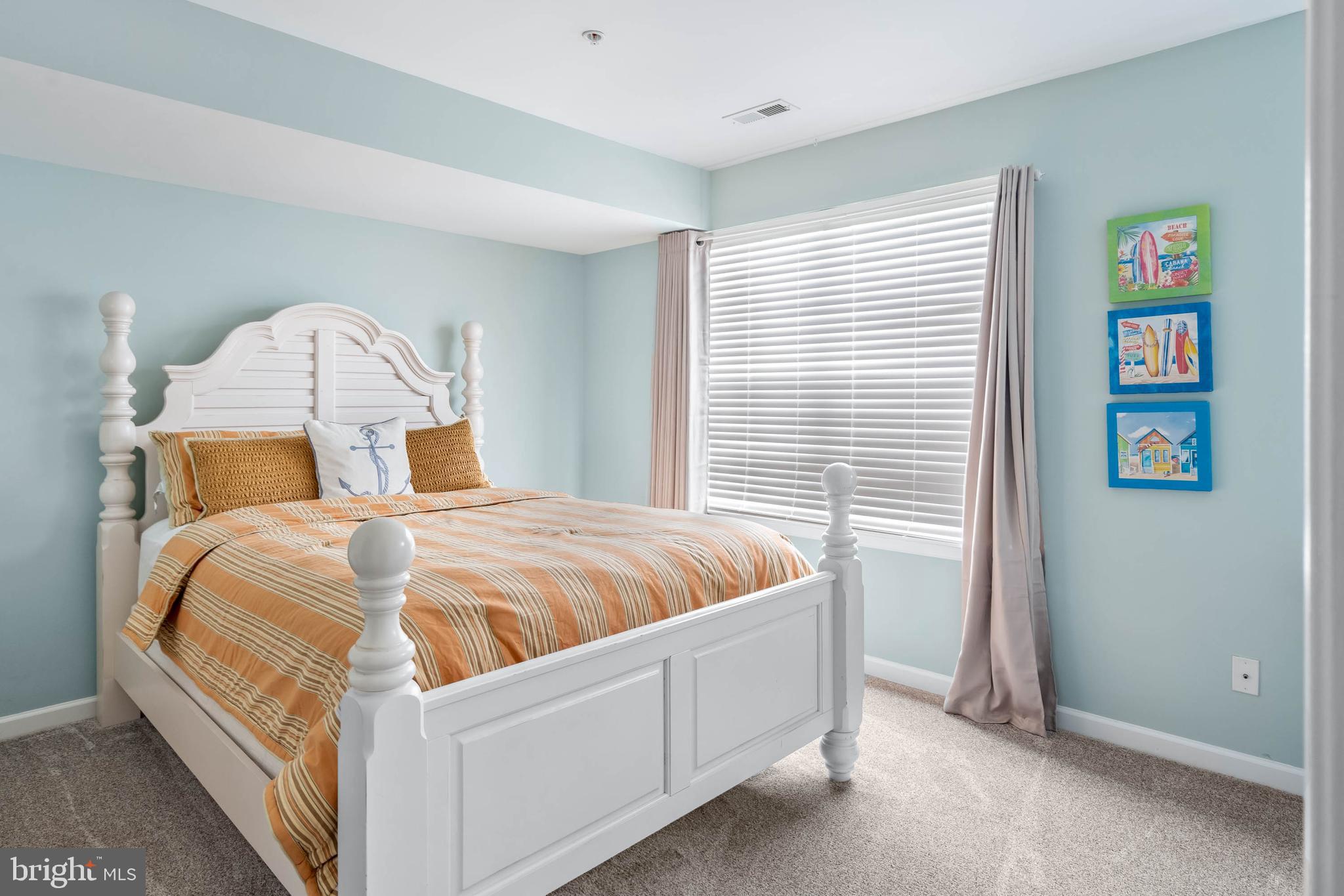 19901 Ames Drive, Unit 133 Rehoboth Beach, DE 19971 - Photo 22 of 34 a bedroom with a bed and a window