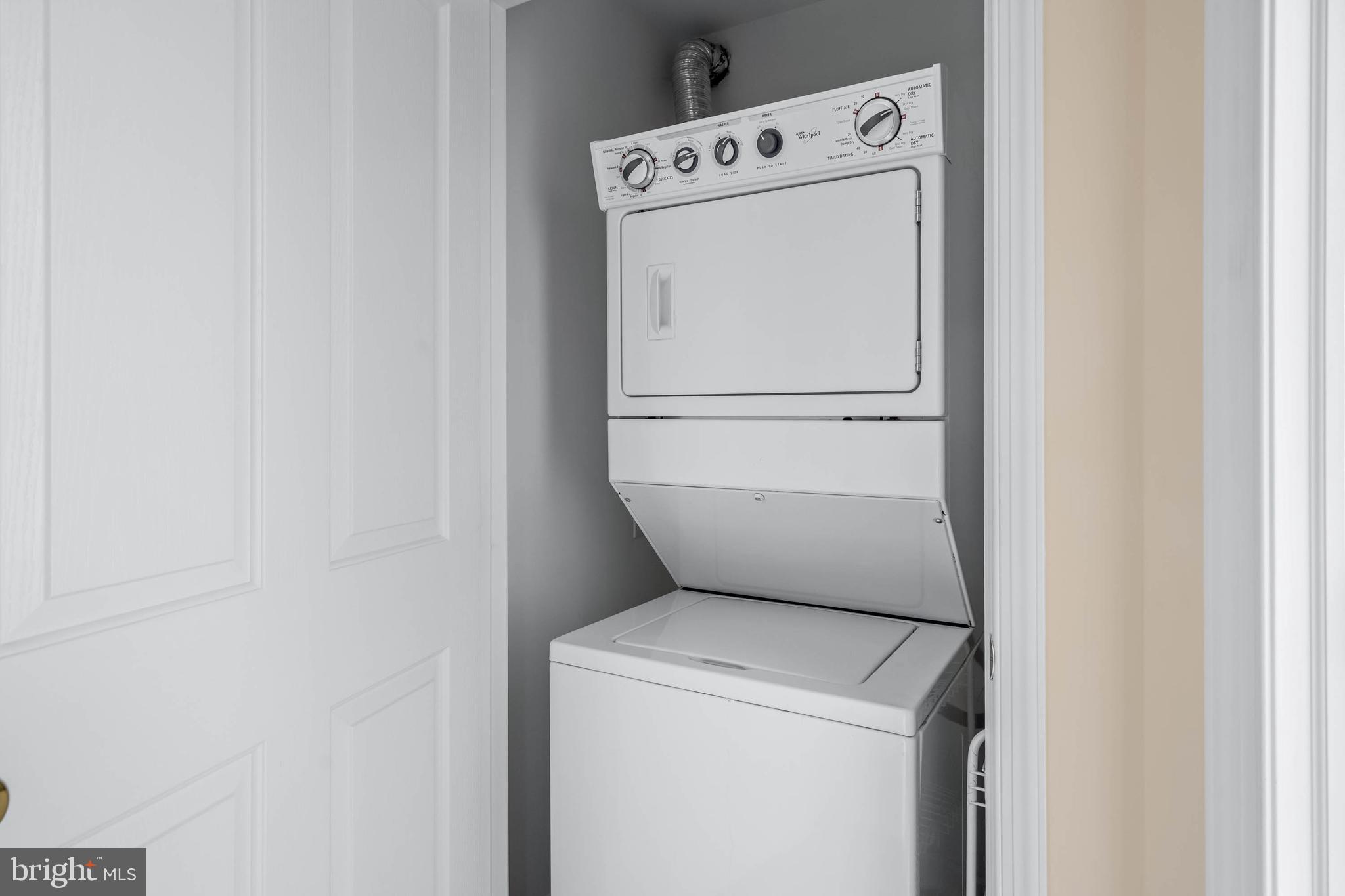 19901 Ames Drive, Unit 133 Rehoboth Beach, DE 19971 - Photo 28 of 34 a utility room with dryer and washer