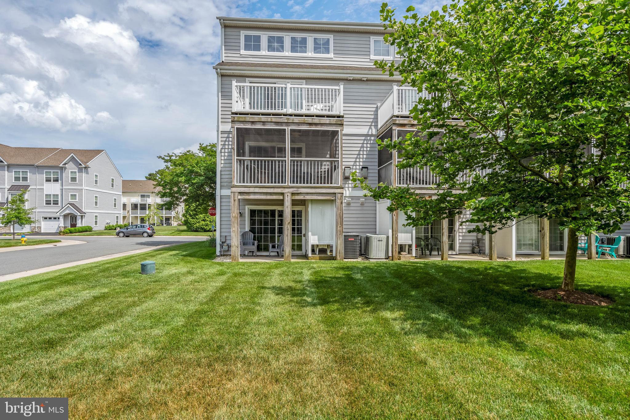 19901 Ames Drive, Unit 133 Rehoboth Beach, DE 19971 - Photo 33 of 34 a view of building with yard