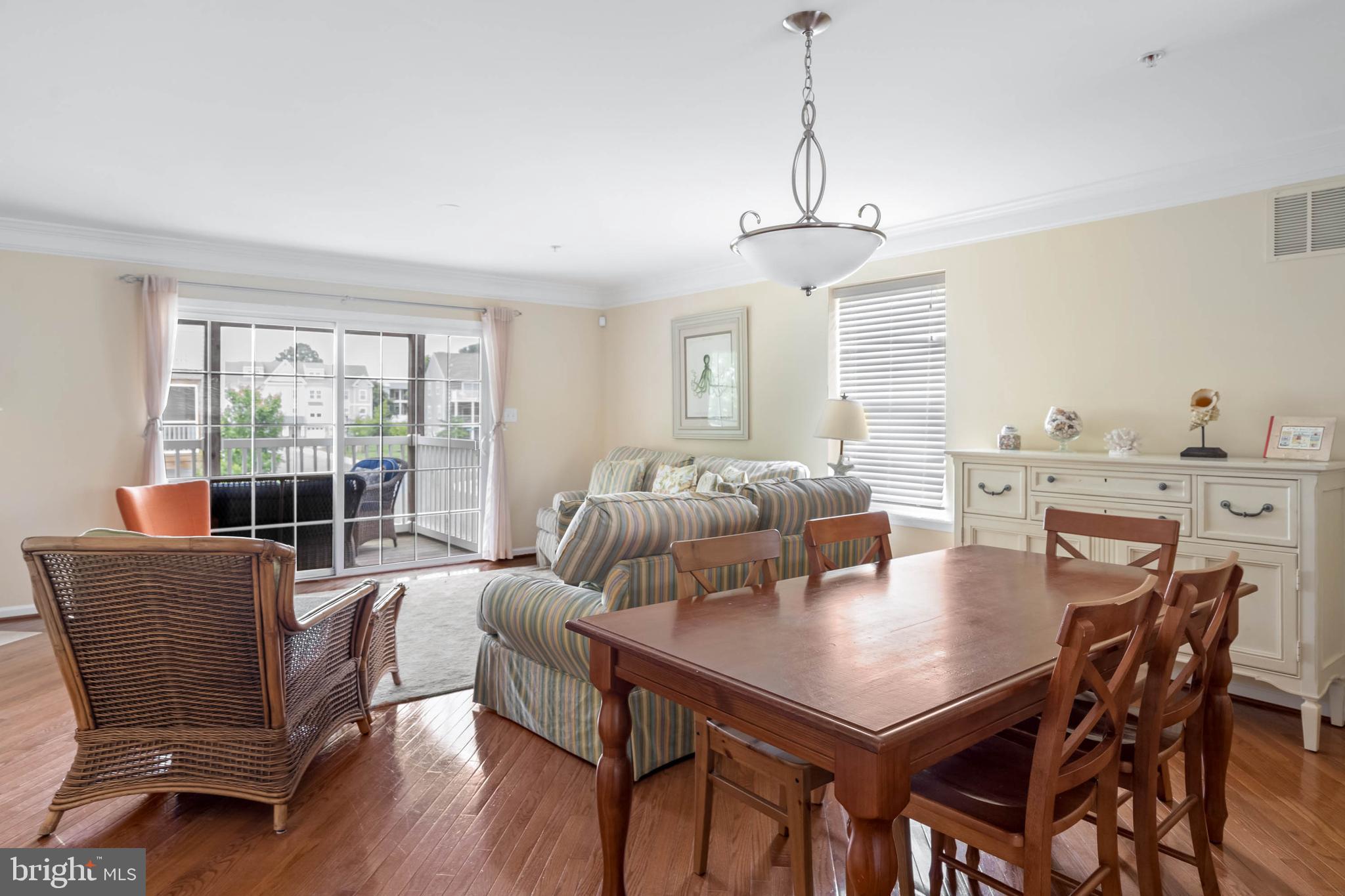 19901 Ames Drive, Unit 133 Rehoboth Beach, DE 19971 - Photo 8 of 34 a view of a dining room with furniture window and outside view