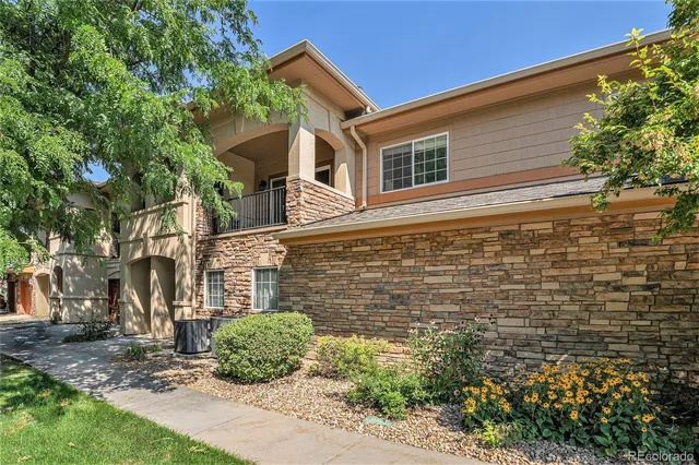 a view of a balcony with furniture