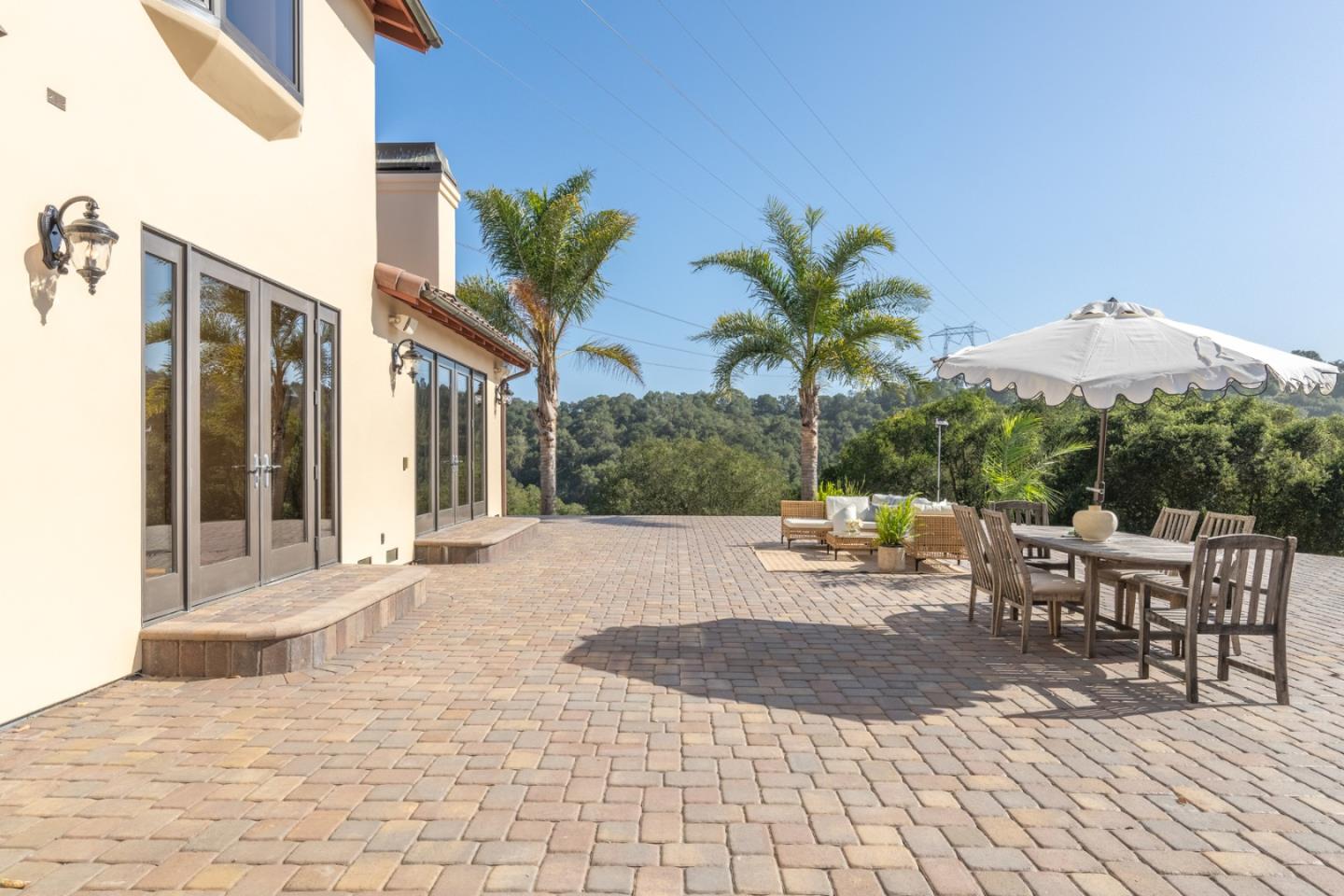 67 Tucker Road Watsonville, CA 95076 - Photo 22 of 32 a view of a patio with a dining table and chairs with wooden floor