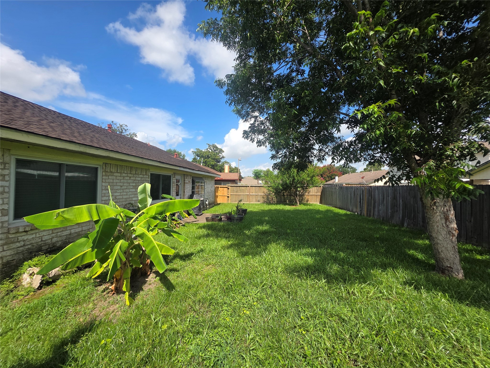 12531 La Rochelle Drive Houston, TX 77015 - Photo 15 of 15 a view of a house with a yard and a garden