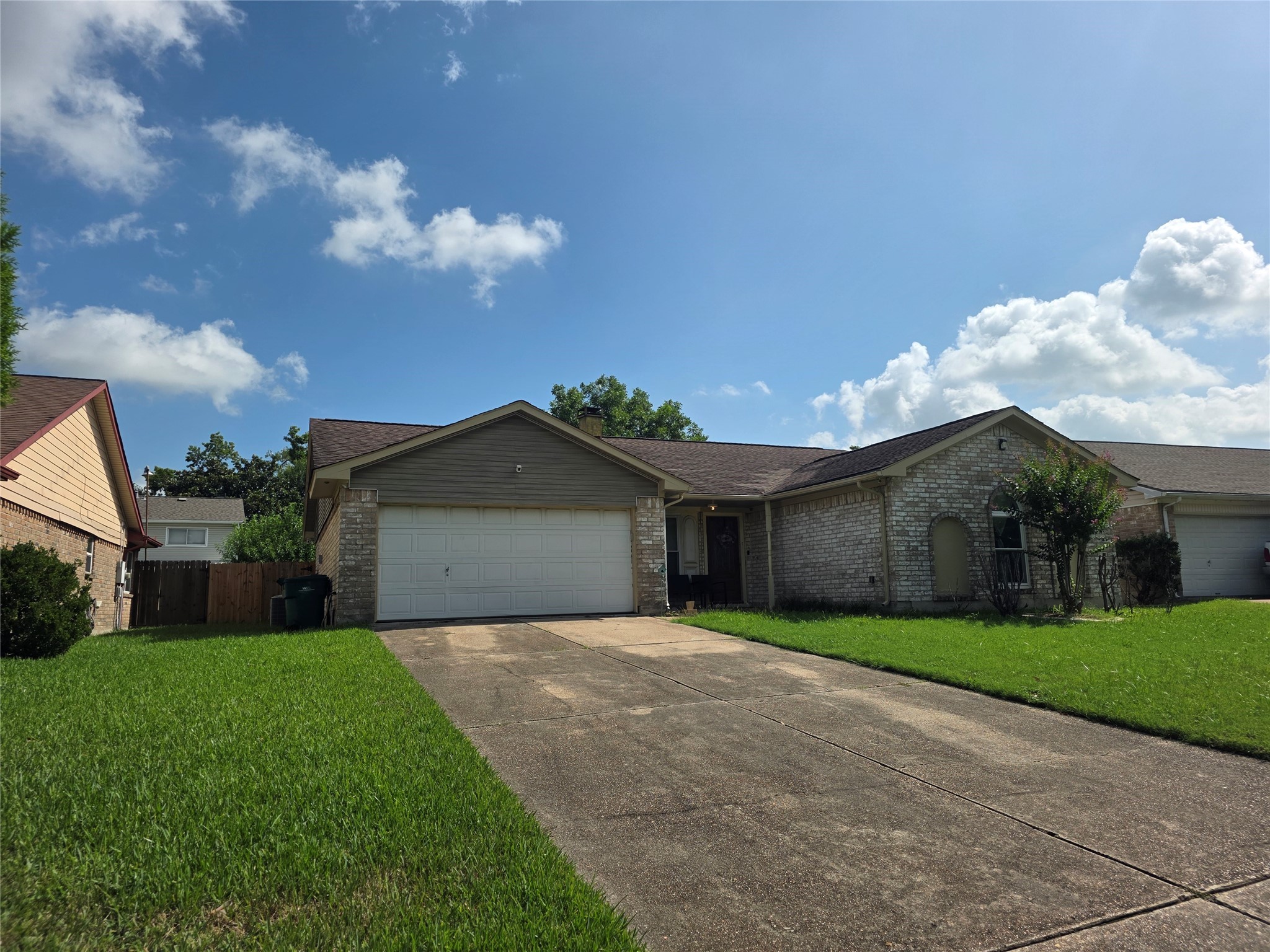 12531 La Rochelle Drive Houston, TX 77015 - Photo 2 of 15 a front view of a house with a yard and garage