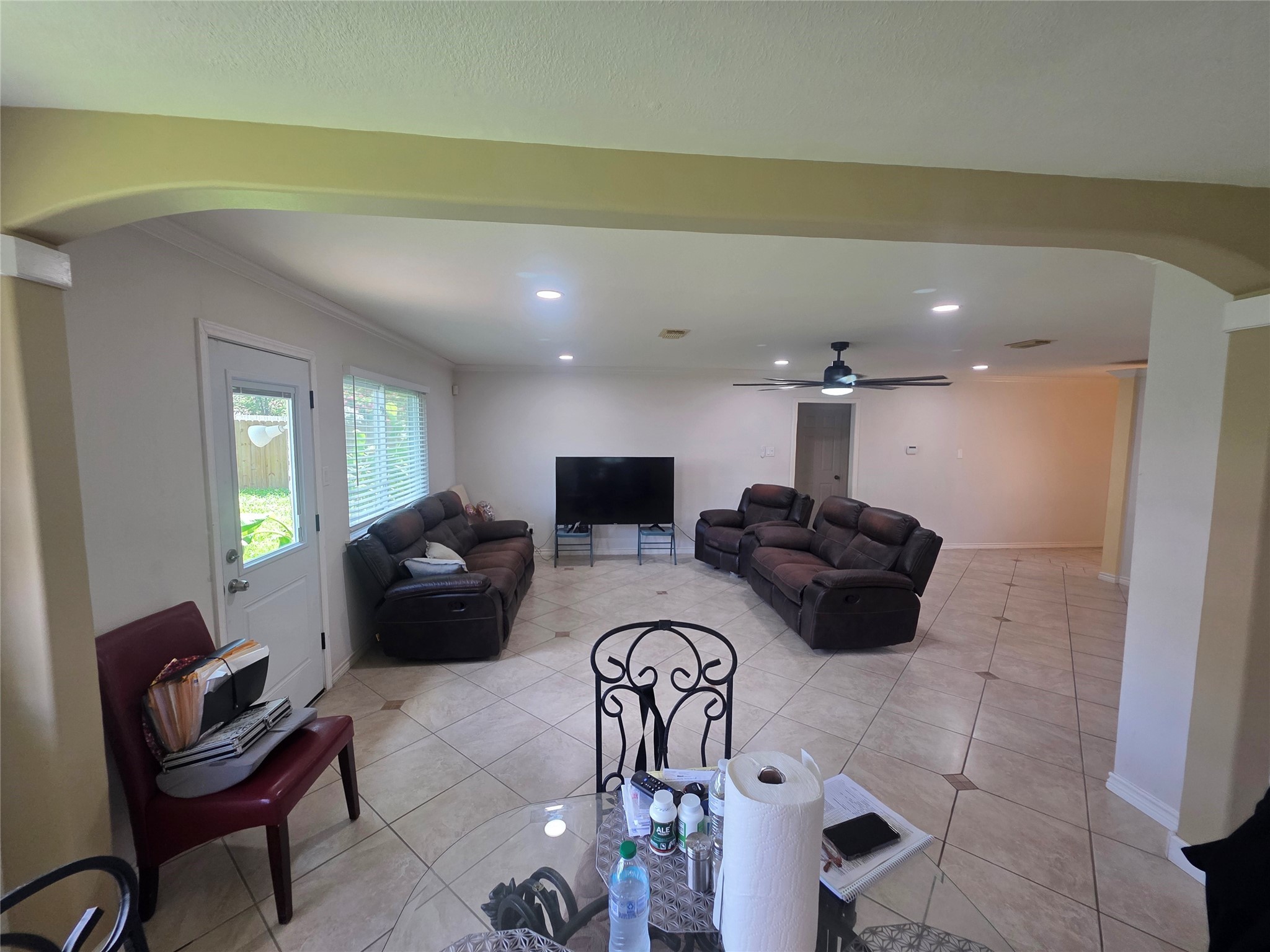 12531 La Rochelle Drive Houston, TX 77015 - Photo 8 of 15 a living room with furniture a flat screen tv and a large window
