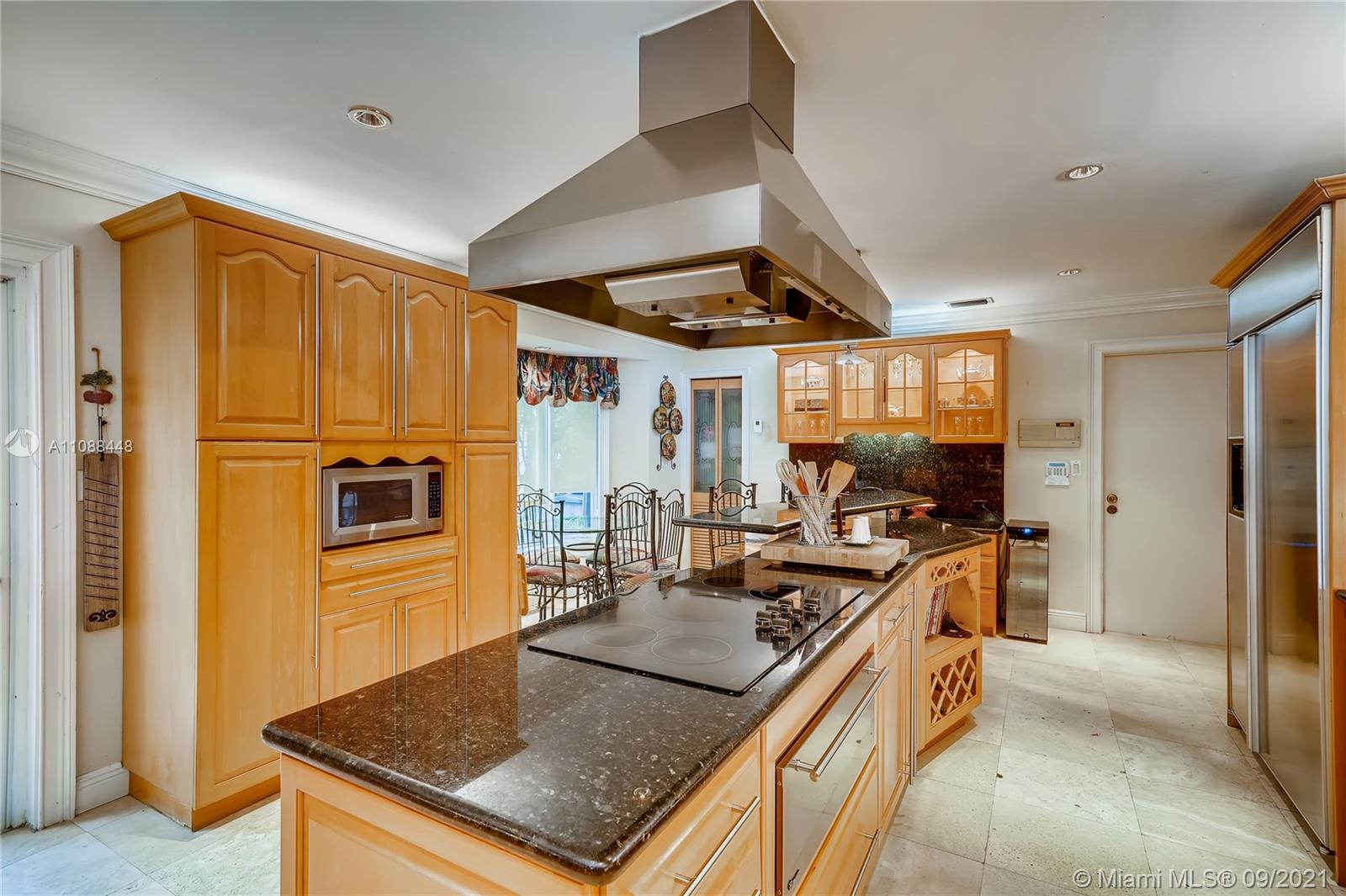 1851 Southwest 126th Court Miami, FL 33175 - Photo 20 of 27 a kitchen with stainless steel appliances granite countertop a sink and a refrigerator