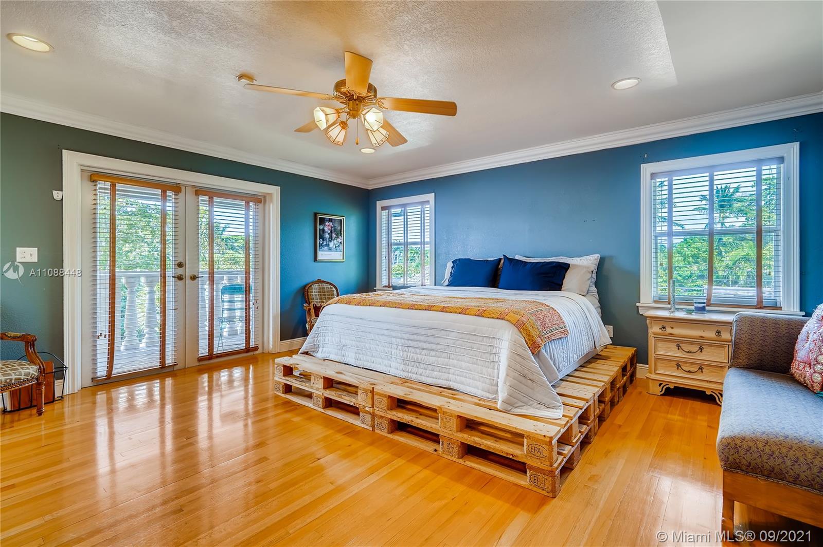 1851 Southwest 126th Court Miami, FL 33175 - Photo 25 of 27 a bedroom with a bed and wooden floor