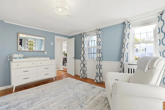 a bed room with a bed and a window